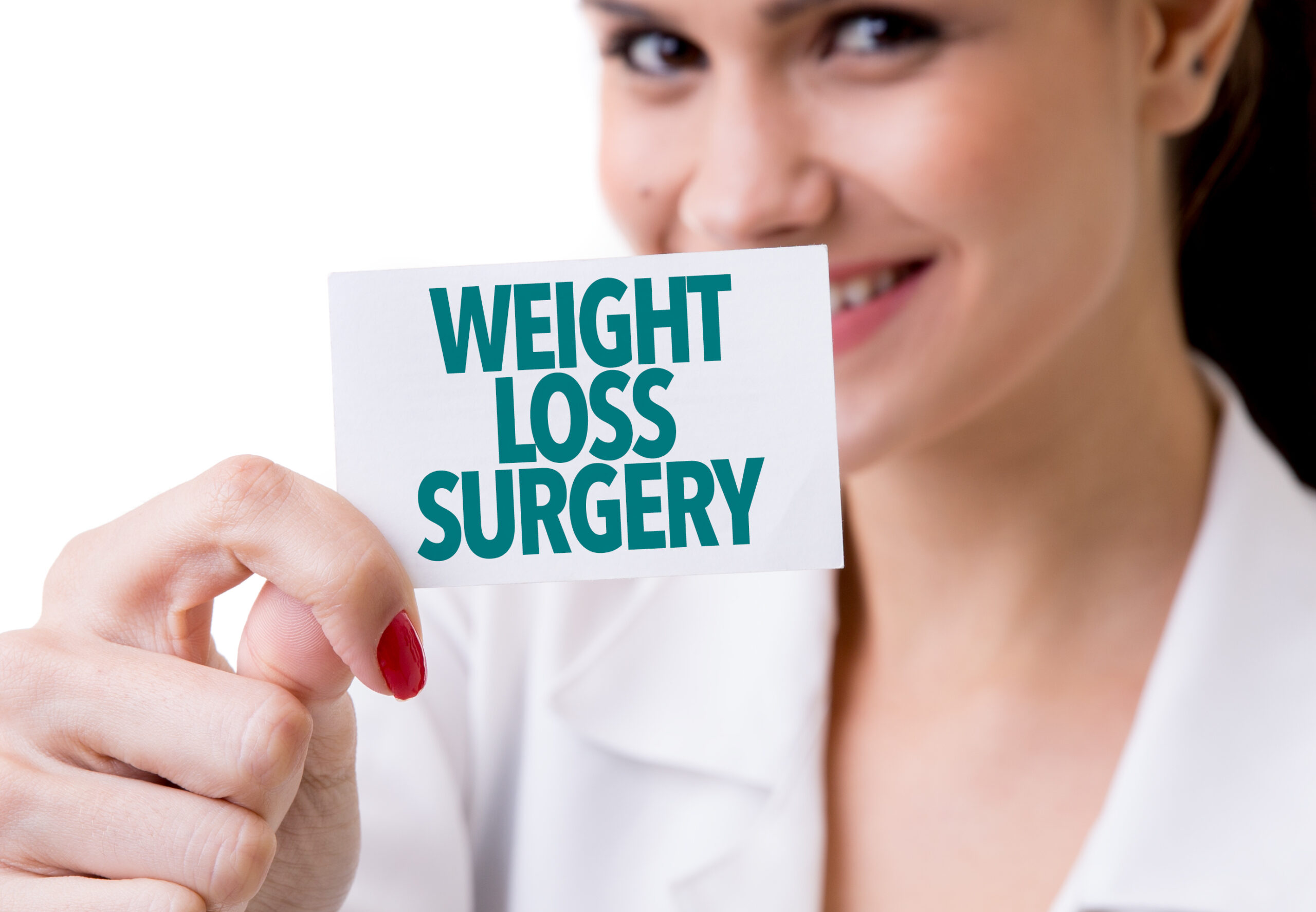 Female Doctor showing a note which reads "Weight Loss Surgery"